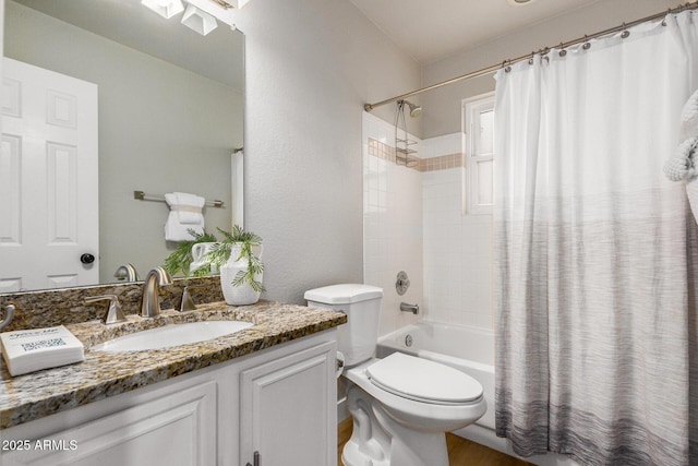 full bathroom with shower / bath combo, vanity, and toilet