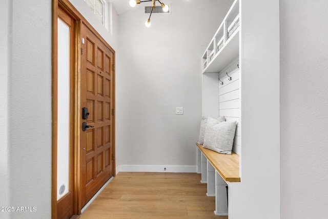 mudroom with light hardwood / wood-style floors