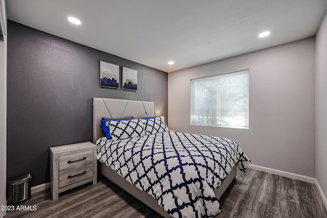 bedroom featuring dark wood finished floors, baseboards, and recessed lighting