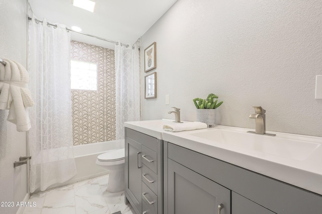 bathroom featuring shower / bath combination with curtain, double vanity, toilet, and a sink