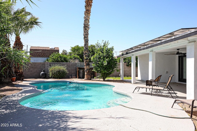 view of swimming pool with a fenced backyard, a fenced in pool, and a patio