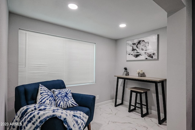 sitting room featuring marble finish floor, baseboards, and recessed lighting
