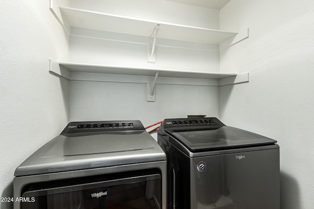 clothes washing area featuring independent washer and dryer