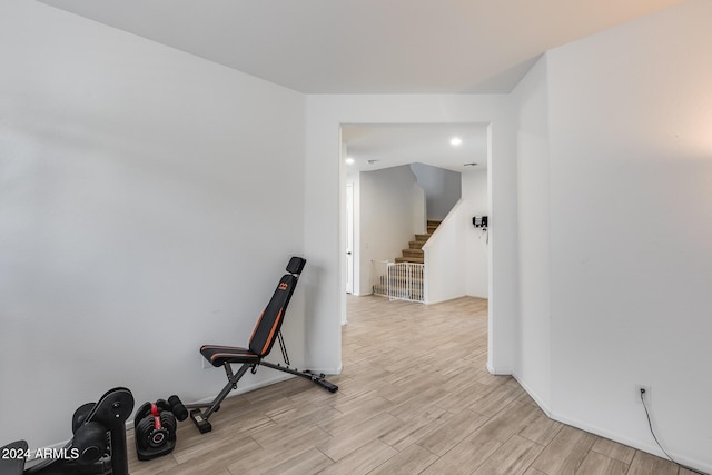 exercise area with light hardwood / wood-style floors