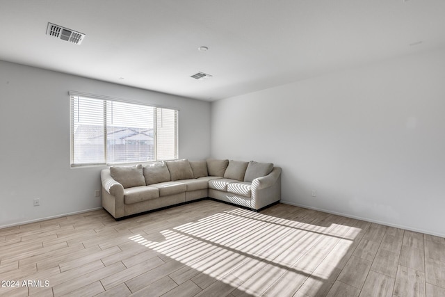 unfurnished living room with light hardwood / wood-style floors