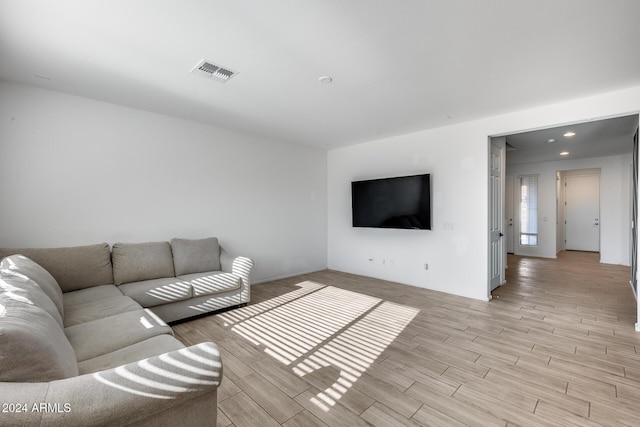 unfurnished living room with light hardwood / wood-style flooring