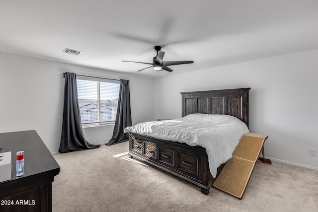 bedroom with light carpet and ceiling fan