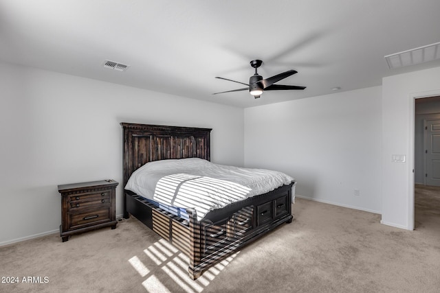 bedroom featuring ceiling fan and light colored carpet