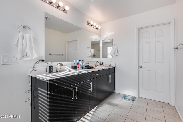 bathroom with tile patterned floors and vanity