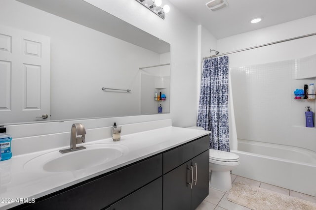 full bathroom with tile patterned flooring, shower / tub combo, vanity, and toilet