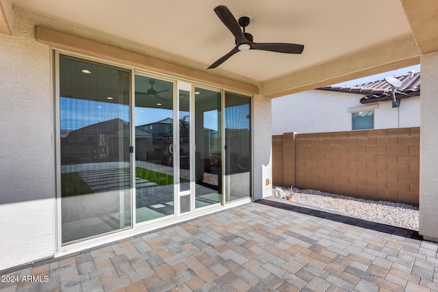 view of patio featuring ceiling fan