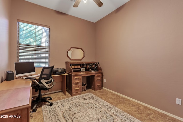 office featuring ceiling fan, baseboards, and lofted ceiling