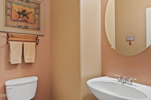 bathroom featuring a sink and toilet