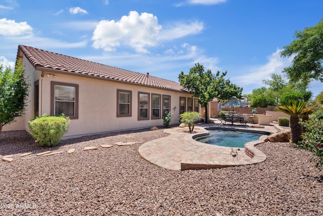 view of pool featuring a patio and fence