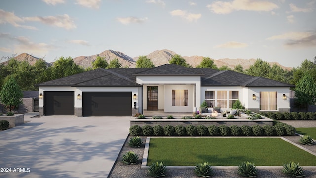 prairie-style house featuring a mountain view and a garage