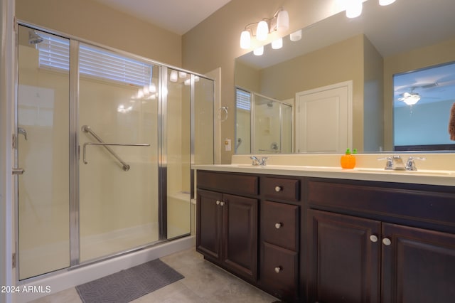 bathroom with vanity and walk in shower