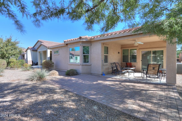 exterior space featuring ceiling fan and a patio area