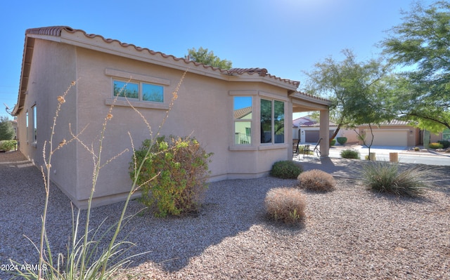 view of property exterior featuring a garage