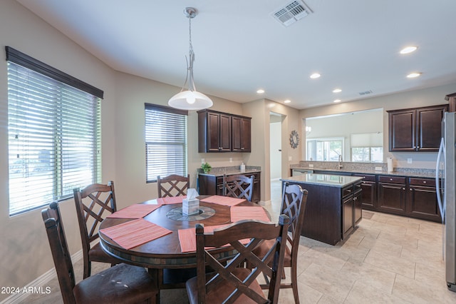 dining room featuring sink