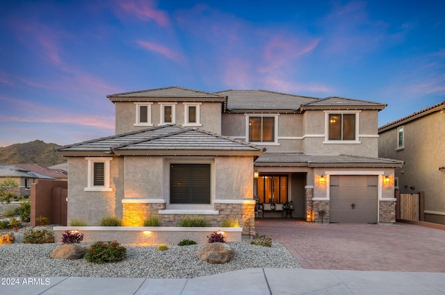 prairie-style home featuring a garage