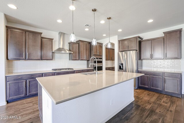 dining area featuring dark hardwood / wood-style floors, ceiling fan, and sink