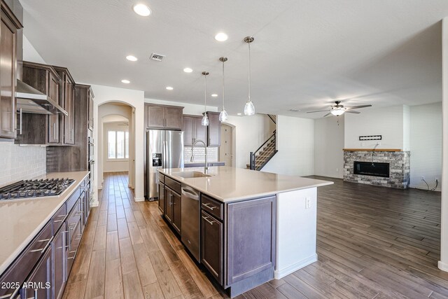 dining area featuring ceiling fan and dark hardwood / wood-style floors