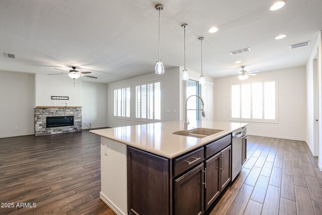 living room with ceiling fan and wood-type flooring