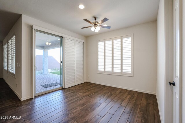 dining room featuring ceiling fan and dark hardwood / wood-style floors