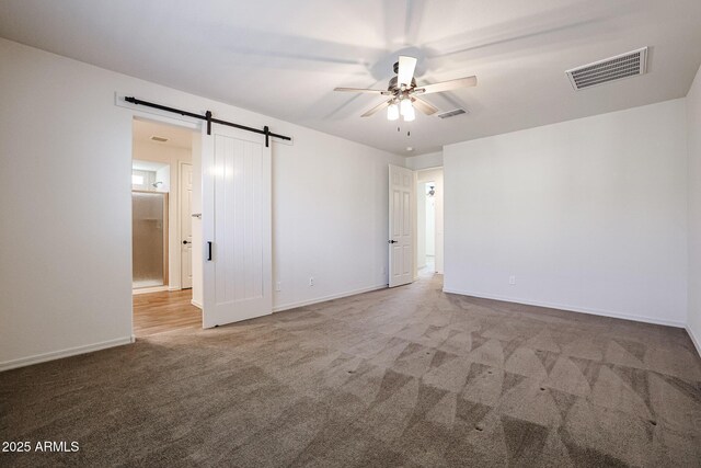 unfurnished living room with dark hardwood / wood-style flooring and ceiling fan