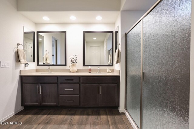 kitchen featuring dark brown cabinets, dark hardwood / wood-style floors, and decorative backsplash