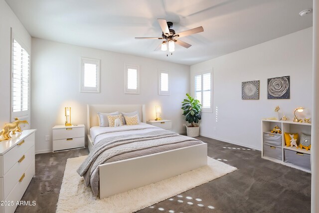 carpeted bedroom with ceiling fan and a closet