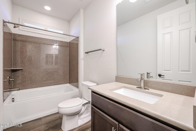 clothes washing area with dark hardwood / wood-style floors, washer and dryer, and cabinets