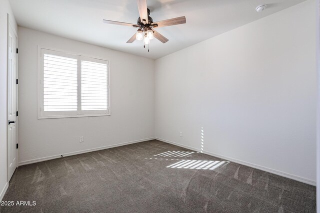 workout room with ceiling fan and dark colored carpet