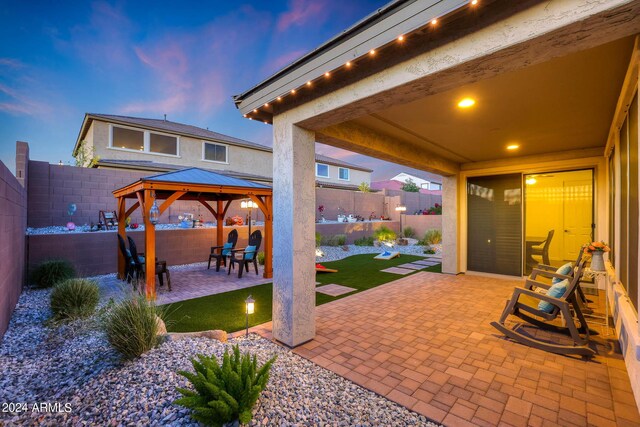 view of yard at dusk