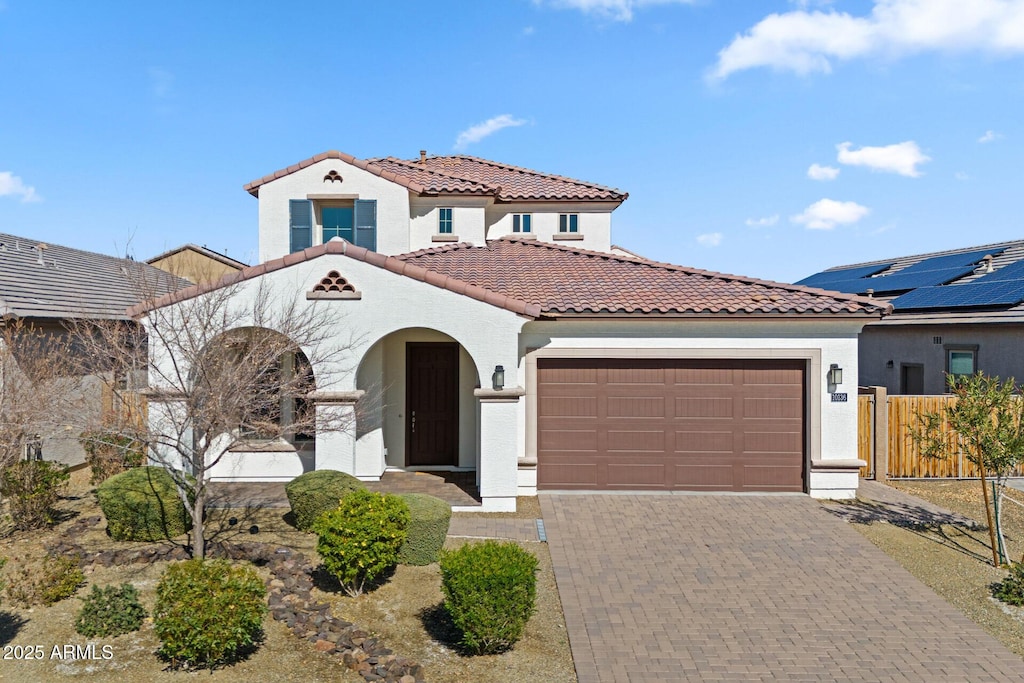 mediterranean / spanish-style home featuring a garage