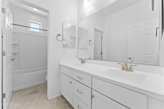 full bathroom with vanity, tile patterned floors, washtub / shower combination, and toilet