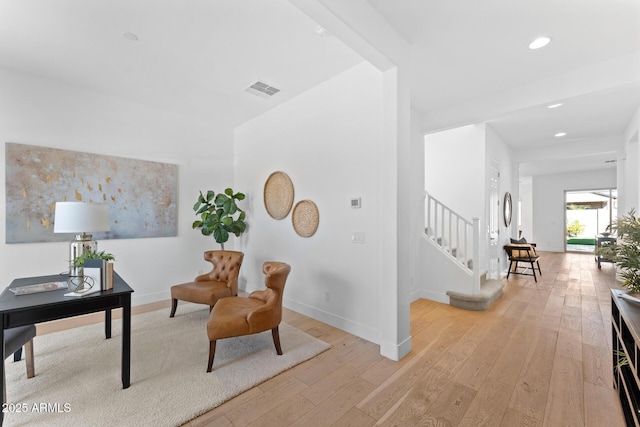 office with light hardwood / wood-style flooring