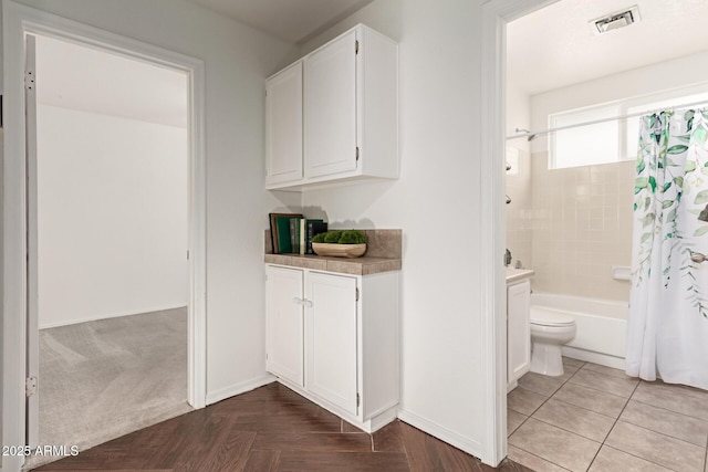 18219 N 19th St, Phoenix, AZ 85022 - full bathroom with shower / bathtub combination with curtain, vanity, toilet, and baseboards