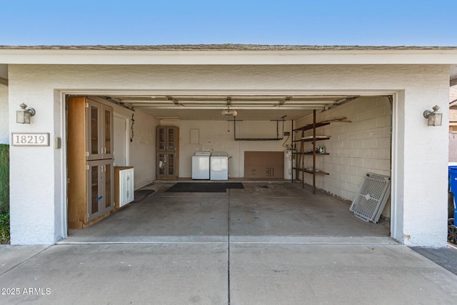 18219 N 19th St, Phoenix, AZ 85022 - garage featuring washing machine and dryer, water heater, and concrete driveway