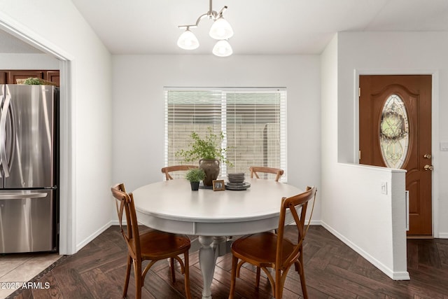 18219 N 19th St, Phoenix, AZ 85022 - dining space with a chandelier and baseboards