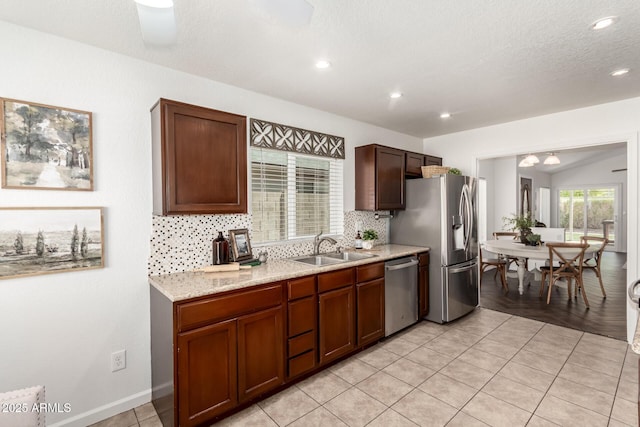 18219 N 19th St, Phoenix, AZ 85022 - kitchen with appliances with stainless steel finishes, a sink, decorative backsplash, recessed lighting, and light tile patterned flooring