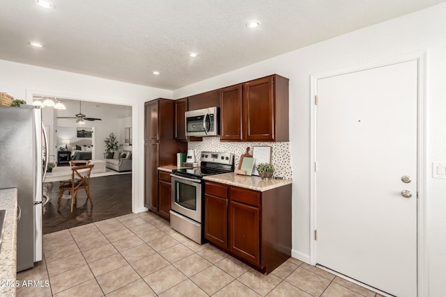 18219 N 19th St, Phoenix, AZ 85022 - kitchen featuring stainless steel appliances, light tile patterned flooring, tasteful backsplash, ceiling fan, and recessed lighting