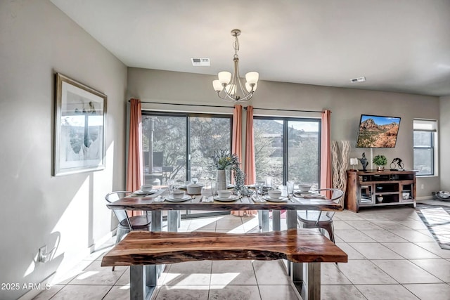 33 Monterey Cir, Sedona, AZ 86351 - dining room featuring a chandelier, light tile patterned floors, and healthy amount of natural light