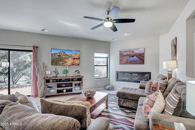 33 Monterey Cir, Sedona, AZ 86351 - living room featuring tile patterned flooring, a ceiling fan, and baseboards