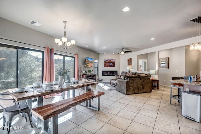33 Monterey Cir, Sedona, AZ 86351 - dining area with a chandelier, light tile patterned flooring, a ceiling fan, recessed lighting, and baseboards