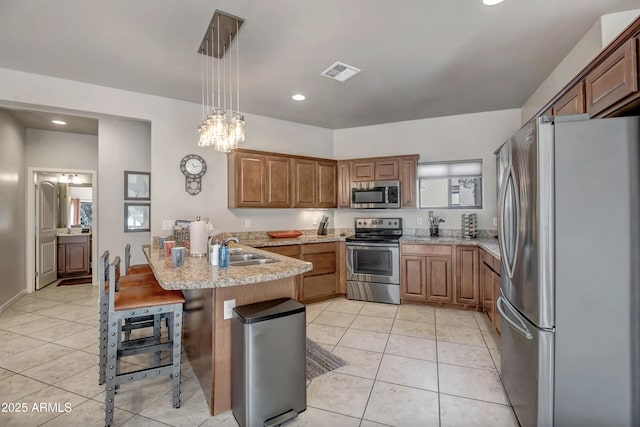 33 Monterey Cir, Sedona, AZ 86351 - kitchen featuring appliances with stainless steel finishes, a peninsula, a sink, light tile patterned floors, and recessed lighting