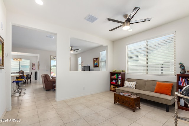 living room featuring ceiling fan and light tile floors