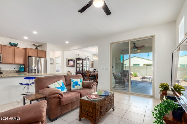 tiled living room featuring a wealth of natural light and ceiling fan