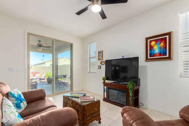 living room featuring a healthy amount of sunlight, tile flooring, and ceiling fan