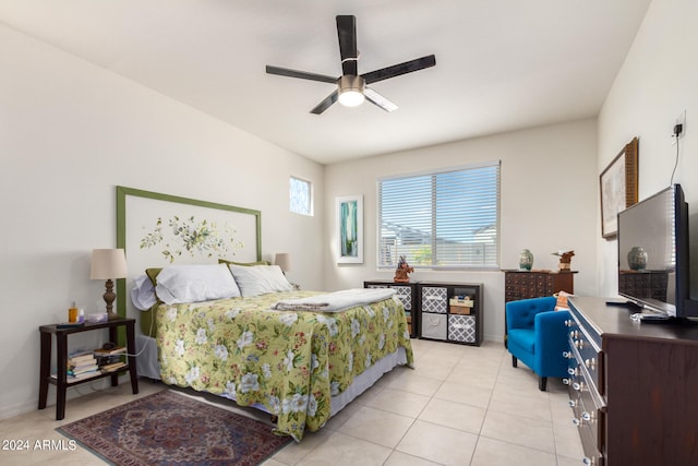 tiled bedroom with ceiling fan